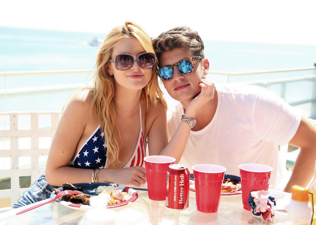 Bella Thorne In Low Cut National Colored Swimsuit 00